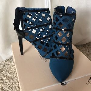 Teal and black pumps